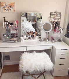 a white desk topped with a mirror and lots of makeup on it's sides