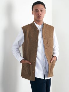 We never mess with our classics. One of our most popular designs, this Nehru Waistcoat is made from Shetland wool with a beautiful fawn herringbone finish. Made with a regular fit, it is lined with cotton for a comfortable feel all around. It makes for the perfect piece for a weekend in the countryside, finding home nicely both in nature and at the local pub alike. Sleeveless and Mandarin-collared, we've finished it with three large patch pockets, internal jet pockets and characterful coconut bu Shetland Wool, Popular Designs, Boxer Shorts, Mandarin Collar, In Nature, Online Purchase, Welt Pocket, Herringbone