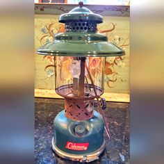 an old fashioned blender sitting on top of a counter