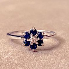 14kt White Gold Diamond And Blue Sapphire “Flower” Style Cluster Ring. Currently A Size 6.5, But Can Be Made Larger Or Smaller By Any Jeweler. All Serious Offers Will Be Considered! Gift Sapphire Cluster Ring Hallmarked, Gift Cluster Sapphire Ring, Sterling Silver Cluster Sapphire Ring Gift, Blue Sapphire Ring, Flower Style, Ring Color, Blue Sapphire Rings, Flower Fashion, Cluster Ring