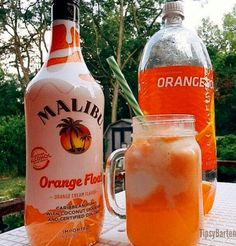 an orange beverage is sitting on a table