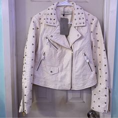 Super Cute Edgy White Studded Leather Jacket Beautiful Design Fashionable Style (Check All Pictures For Imperfections) Factory/Store Flaws Size L Perfect For Dates Date Night Bikers Summer Resorts Hotels Fancy Events Weddings Parties Casinos Las Vegas Everywhere!Get Your Holiday Shopping! Bundle And Save!! Items May Come With Few Stray Cat Hairs I Try My Best To Clean Them Before Shipping Any More Questions Please Ask!! Price Firm!!!!!!!!!!!!!! White Long Sleeve Biker Jacket For Winter, Winter White Leather Jacket With Long Sleeves For Fall, Cream Fitted Biker Jacket For Fall, Fitted Cream Biker Jacket For Fall, Winter White Leather Jacket For Fall, White Biker Jacket With Zipper For Spring, Zara Fitted Leather Jacket With Long Sleeves, White Spring Outerwear With Zipper Closure, Fitted White Leather Jacket For Winter