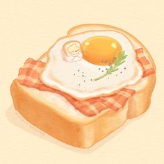 an egg in a toasted bread with a doll sitting on top of the piece