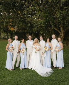 a bride and groom with their bridal party