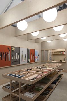 an empty room with many different items on the table and shelves in front of them