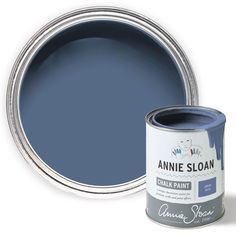 a can of annie sloan chalk paint next to it's blue tin with the lid open