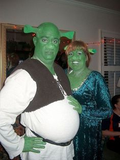 a man and woman dressed up in costumes