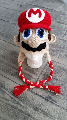 a crocheted hat with a mustache on it