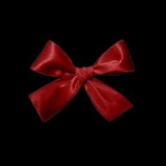 a red bow on a black background