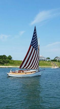 a boat with an american flag on it in the water