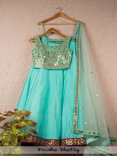 Arctic Blue Mirror Work Lehenga Set (Set of 3) By Anisha Shetty now available at Trendroots Net Embroidery Lehenga, Mirror Work Dupatta, Mirror Blouse, Embroidery Lehenga, Gown Designs, Gold Lehenga, Mirror Work Lehenga, Net Embroidery, Raw Silk Lehenga