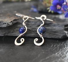 This wire wrapped dangle and drop earrings come with Lapis Lazuli beads are made with German silver. The elegant and sharp design of this pieces will bring so much beauty and attention to you, helping you in reinforcing your self confidence. It is said that Lapis Lazuli was one of the favorite stones of Cleopatra, very present in the Egyptian culture. It is particularly helpful in identifying negative emotions. Please feel free to contact me with any questions you may have. I would love to help! Elegant Adjustable Pendant Earrings, Adjustable Sterling Silver Clip-on Earrings, Elegant Sterling Silver Nickel-free Cartilage Earrings, Elegant Nickel-free Sterling Silver Cartilage Earrings, Elegant Sterling Silver Dangle Cartilage Earrings, Elegant Blue Cartilage Earrings For Gift, Adjustable Wire Wrapped Sterling Silver Earrings, Sterling Silver Wire Wrapped Linear Earrings For Gifts, Sterling Silver Wire Wrapped Linear Earrings As Gift