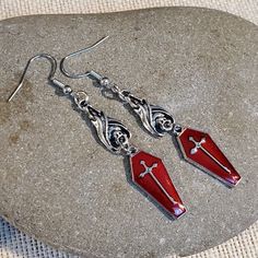 Add An Edgy Touch To Your Outfit With These Asymmetrical Dangle/Drop Earrings From Cascade Jewelry. The Blood Red Enamel Coating And Pewter Base Metal Create A Gothic, Punk, And Bohemian Vibe. These Earrings Feature A Vampire Coffin And Hanging Bat Design With A Silver Cross Accent, Making Them Perfect For Those Who Love Art, Retro Style, And Costumes. The Hook Closure And Stainless Steel Metal Ensure Durability, While The 11 Mm Item Diameter And 71 Mm Item Length Make Them Suitable For Lobe Ear Vampire Coffin, Red Vampire, Hanging Bat, Bat Design, Gold Bead Earrings, Glass Drop Earrings, Earrings Handmade Dangle, Gothic Punk, Beaded Drop Earrings