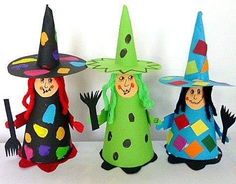 three paper dolls are dressed up as witches