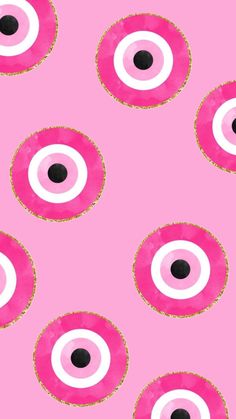 pink and white circles with black dots on a pink background