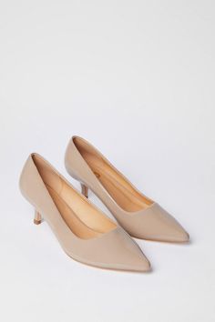 Elegant kitten heel court shoes with a mid-height heel between 5 and 6.5cm
Sleek pointed toe design for a sophisticated silhouette
Versatile slip-on style for easy wear
Crafted from faux leather for a polished look
Ideal for both office wear and special occasions
Step into refined style with these Dove Kitten Heel Court Shoes from Dorothy Perkins. Perfect for the fashion-conscious woman in her 30s, these shoes strike the ideal balance between trend and timeless elegance. The mid-height heel offers comfort for all-day wear, making them an excellent choice for the office or client meetings. Pair them with tailored trousers and a crisp blouse for a professional look that transitions seamlessly from boardroom to after-work drinks. For weekend brunches or baby showers, style these versatile c Beige Kitten, Woman In Her 30s, Work Wear Outfits, Court Heels, Petite Coat, Blouse Jeans, Floral Outfit, Refined Style, Tshirt Skirt