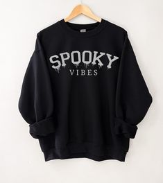 This embroidered Spooky Season crewneck is the perfect addition to your fall / autumn wardrobe. Whether you're wearing it to a Halloween party, or just need more sweater weather crewnecks, this is the perfect unisex sweatshirt for you! Our crewnecks use the highest quality material for ultra-soft and comfortable wear, with advanced printing to ensure vibrant colors and detailed graphics. Note: White & Athletic Grey crewnecks are embroidered with maroon thread and all other colored crewnecks are Speak Now Concert, Sweatshirts Aesthetic, Taylor Version, Halloween Crewneck Sweatshirt, Spooky Sweatshirt, Halloween Crewneck, Autumn Wardrobe, Cute Shirt Designs, Sweatshirt Halloween