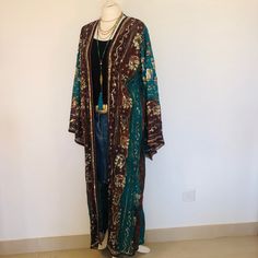 "A Beautiful Long Boho Hippie Chic Kimono Jacket. Sequinned,Beaded and Embroidered ; Perfect for Holidays,Parties,Weddings and Celebrations as a Cover Up. Handmade in India from a Vintage Sari , so completely unique and sustainable. The Fabric is a Gorgeous and Flattering Teal and Chocolate Chiffon .  The Exquisite embellishment features a Lush Gold floral print, and 1000's of Glittering Gold Beads ,Mother of Pearl beads and Sparkling Sequins. The size will fit and flatter sizes  S M L.      UK 12 to 18 , US 8 to 14. EU 38 to 46. The length is 126 cm / 50 \". The Kimono style sleeves are 58 cm / 23 \". The fabric is delicate ,so please hand wash in cool water,mild soap and dry and store flat . Timeless Boho Chic . To see more unique designs like this please visit my Etsy Boutique at: https Vintage One Size Outerwear For Festival, One Size Vintage Outerwear For Festivals, Vintage One-size Outerwear For Festivals, Bohemian Floor-length Kimono For Festive Occasions, Festive Floor-length Bohemian Kimono, Festive Bohemian Floor-length Kimono, Bohemian Festival Kaftan With Sequins, Bohemian Sequin Kaftan For Festivals, Bohemian Outerwear For Fall Wedding