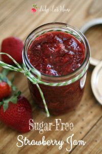 strawberry jam in a mason jar with strawberries on the side and text overlay that reads sugar - free strawberry jam