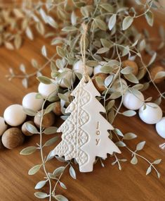 an ornament hanging from a tree on a table