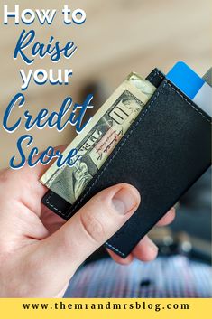 a person holding a wallet with money in it and the words how to raise your credit score