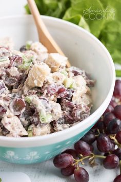 a close up of a bowl of food with grapes