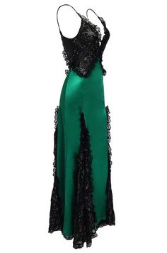 Giselle Sequined Lace Satin Maxi Dress is made of soft satin like fabric. It's lace patchwork is decorated with sequins. It features a plunging neckline with adjustable spaghetti straps, hidden back zip closure, and a fishtail maxi length. Sequined lace;  Soft Satin ;  Fishtail;  Imported;  Dry clean only; Glamorous Green Satin Gown, Green Satin Maxi Dress For Gala, Green Satin Evening Gown, Green Ruffled Evening Dress For Parties, Green Satin Dress With Ruffles, Green Ruffled Gown For Gala, Green Ruffled Evening Dress For Prom, Green Silk Maxi Dress For Gala, Green Silk Maxi Dress For Prom