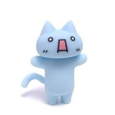 a blue cat figurine with its mouth open and eyes wide open in front of a white background