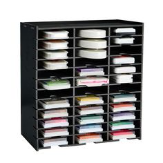 a black shelving unit filled with files and folders