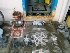 the floor is covered with cement and has designs painted on it, along with other items