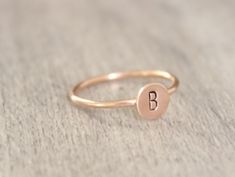 Simple initial stacking ring. Made with 14k gold filled or sterling silver. Please put your initial request in the notes at checkout. This ring is made to order in your size. If you don't see your size available please feel free to message me. All orders ship in a gift box. If you are ordering multiple items and want them boxed separately, please let me know in the notes at checkout. I ship via USPS. Please review the estimated delivery date and processing times. Processing times vary based on h Everyday Rose Gold Initial Ring In Sterling Silver, Everyday Rose Gold Sterling Silver Initial Ring, Dainty Rose Gold Initial Ring Stamped 14k, Dainty Rose Gold Sterling Silver Initial Ring, Minimalist Initial Rose Gold Ring, Rose Gold Initial Ring Stamped 14k For Gift, Simple Rose Gold 14k Gold Initial Ring, Personalized Dainty Initial Ring In Rose Gold, Personalized Dainty Rose Gold Initial Ring