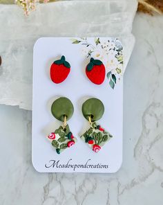 Introducing our delightful Strawberry 🍓 polymer clay earring set. This set includes two charming earrings with a cute strawberry theme. One pair features adorable strawberry studs, while the other showcases a delightful strawberry pattern on dangle studs.  These earrings are the perfect addition to anyone's whimsical and fun style. They make a fantastic gift for birthdays, Christmas, or any holiday celebration! Treat yourself or surprise a loved one with this sweet and playful accessory set. Du Cute Polymer Clay Flower Earrings For Gifts, Strawberry Clay Earrings, Sweet Strawberry Print Jewelry As Gift, Strawberry Earrings Clay, Cute Strawberry Print Earrings For Gifts, Polymer Clay Fruit, Strawberry Hoop Earrings, Clay Fruit, Cute Red Strawberry Print Earrings