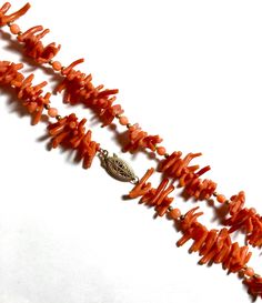 A lovely 14k branch coral necklace. Gobs of individual corals are hand strung with the allure of coral and 14k gf roundels that add a touch of extra class to this necklace! Era 1930-1940's. 17 inch strand choker necklace depending on your neck size. Natural coral branches and coral beads are all intact! Choker necklace is of a higher quality than most I have seen. Varied coral branches measure 1-2cm long. Gold beads test as 14k gold filled also. Fully hallmarked 14/20 and makers mark on box clas Coral Single Strand Necklace For Gift, Coral Single Strand Necklace For Gifts, Hand-strung Red Coral Jewelry In Coral Color, Hand-strung Red Coral Jewelry, Coral Double Strand Jewelry Gift, Coral Double Strand Jewelry As Gift, Gold Single Strand Red Coral Jewelry, Coral Single Strand Jewelry Gift, Double Strand Coral Necklace For Gifts