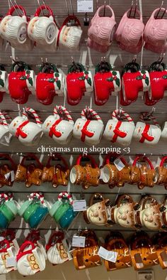 christmas mugs are on display in a store