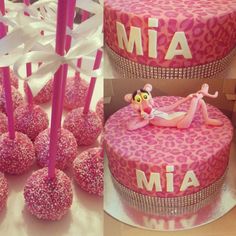 pink cake pops decorated with an animal print design and the word mia on them are surrounded by white ribbon