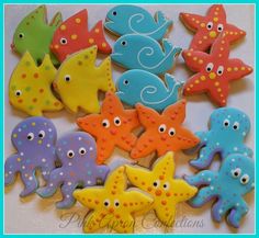 some decorated cookies are sitting on a table