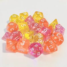 several different colored dices with numbers on them