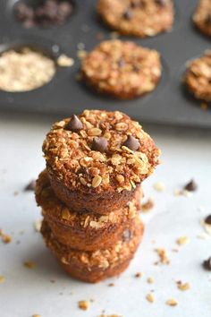 chocolate chip cookies stacked on top of each other in front of muffin tins