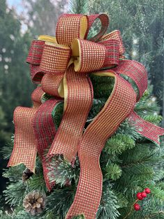 a close up of a christmas tree with a bow