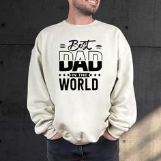 Elevate Dad's wardrobe with our 'Best Dad in the World' Sweatshirt. Whether he's a new dad or a seasoned pro, this cozy hoodie celebrates the joys of dad life. Perfect for Father's Day or any day, it's a heartfelt way to show appreciation for the world's greatest dad. Welcome to VickyTeeDesign Shop! How to Order  * Please choose your t-shirt color and the shirt size by the drop-down menus * Enter the design idea or the personalization if you would like. * Please feel free to ask any questions. M Father's Day Long Sleeve Relaxed Fit Sweatshirt, Father's Day White Graphic Print Sweatshirt, White Graphic Print Sweatshirt For Father's Day, Long Sleeve Top With Text Print For Father's Day, Father's Day Relaxed Fit Letter Print Sweatshirt, Father's Day Letter Print Relaxed Fit Sweatshirt, Father's Day Graphic Print Long Sleeve Sweatshirt, Father's Day Letter Print Sweatshirt, Dads Clothes