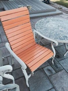 an orange chair and table on a patio