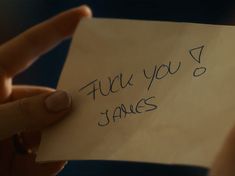 a person holding a piece of paper with writing on it that says, thank you james