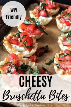 small appetizers with cheese, tomatoes and spinach in them on a baking sheet