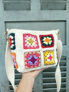 a hand holding a crocheted purse with granny granny granny granny granny granny granny granny granny