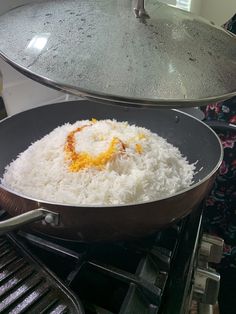 rice is being cooked in a pan on the stove