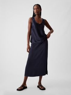 Soft satin midi skirt.  Elasticized waist.  Side slit.  Straight silhouette with a relaxed fit.  Hits below the knee.  Models wearing Gap Grey Chinos, Satin Midi Skirt, Petite Size, The Knee, Midi Skirt, Gap, Womens Skirt, Navy Blue, Relaxed Fit