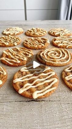 cookies with white icing on a wooden table