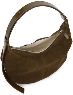 Suede shoulder bag in brown. Adjustable tonal buffed leather shoulder strap with pin-buckle fastening at top. Zip closure at main compartment. Zippered pocket and textile logo patch at interior. Canvas lining in beige. Silver-tone hardware. Approx. 14 length x 9 height x 4 width. Available exclusively at SSENSE. Supplier color: Caramel Nothing Written, Buy Nothing, Textile Logo, Canvas Shoulder Bag, Nylon Bag, Brown Suede, Luxury Streetwear, Rebecca Minkoff Hobo, Patch Logo