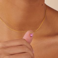 A dainty stone and delicate metallic chain are combined to create this Gold Pendant Necklace in bright pink tourmaline, your new favorite wear-anywhere accessory. The birthstone for the month of October is Pink Tourmaline. This gemstone enhances calmness and compassion. Pink Tourmaline stone; Made of 14K gold-filled Pendant size: 6mm x 4mm with 18" chain. Hypoallergenic, nickel, and lead-free; Tarnish resistant. Ideas to choose your Birthstone Necklace: Your birth month A month that has special Pink Tourmaline Jewelry, Baguette Necklace, October Birthstone Necklace, Tourmaline Jewelry, Tourmaline Stone, Tourmaline Necklace, Gold Gifts, Charm Rings, Gold Pendant Necklace