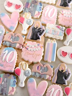 some decorated cookies are laying on a table